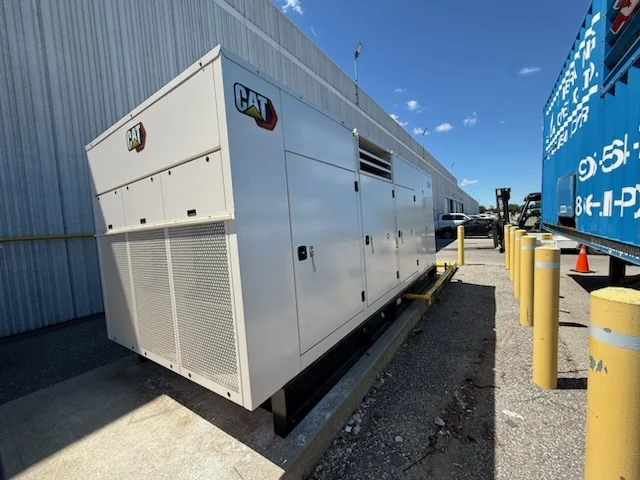 Outdoor generator unit next to industrial building