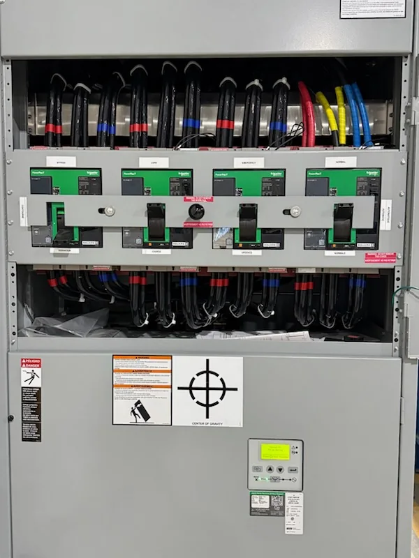 Circuit breakers and wiring inside transfer switch panel
