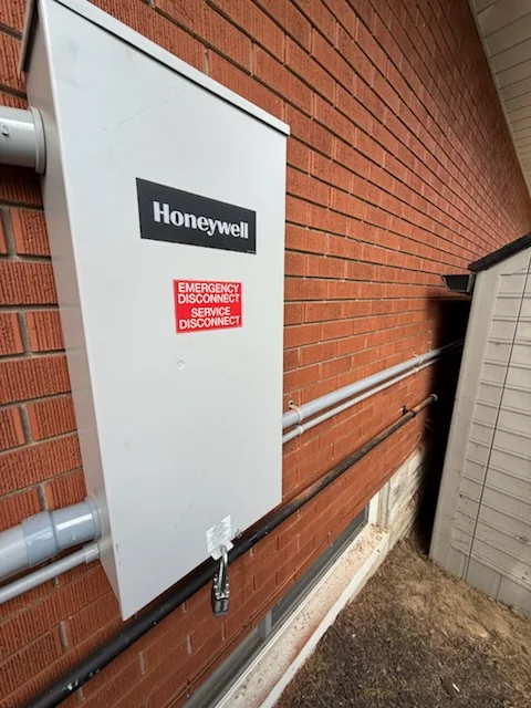 Honeywell emergency disconnect mounted on wall